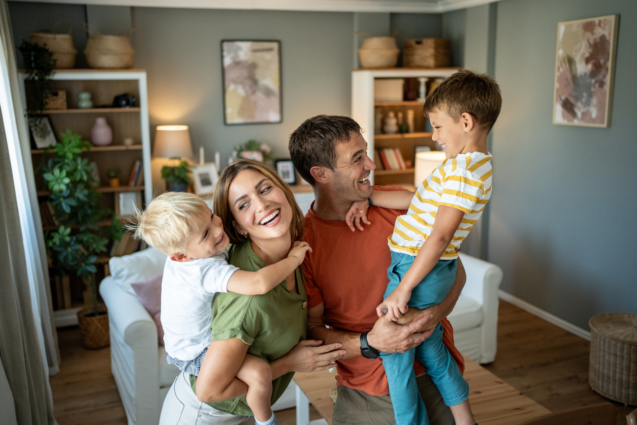 Warm, welcoming image of a family at home, reflecting mortgage protection and security